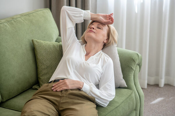 Blonde mid aged woman lying on t
